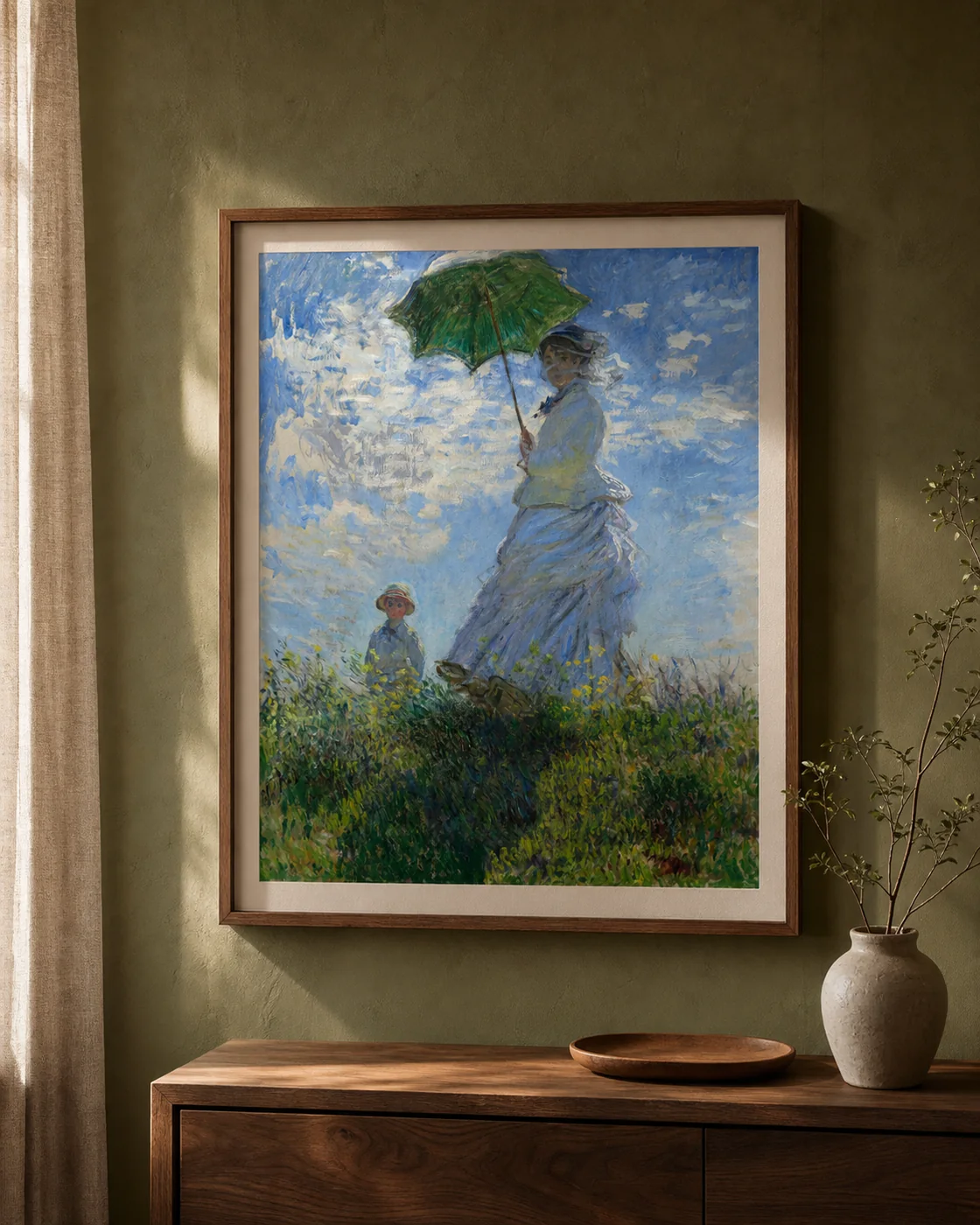 A framed Claude Monet Woman with a Parasol print in a warm, lived-in interior