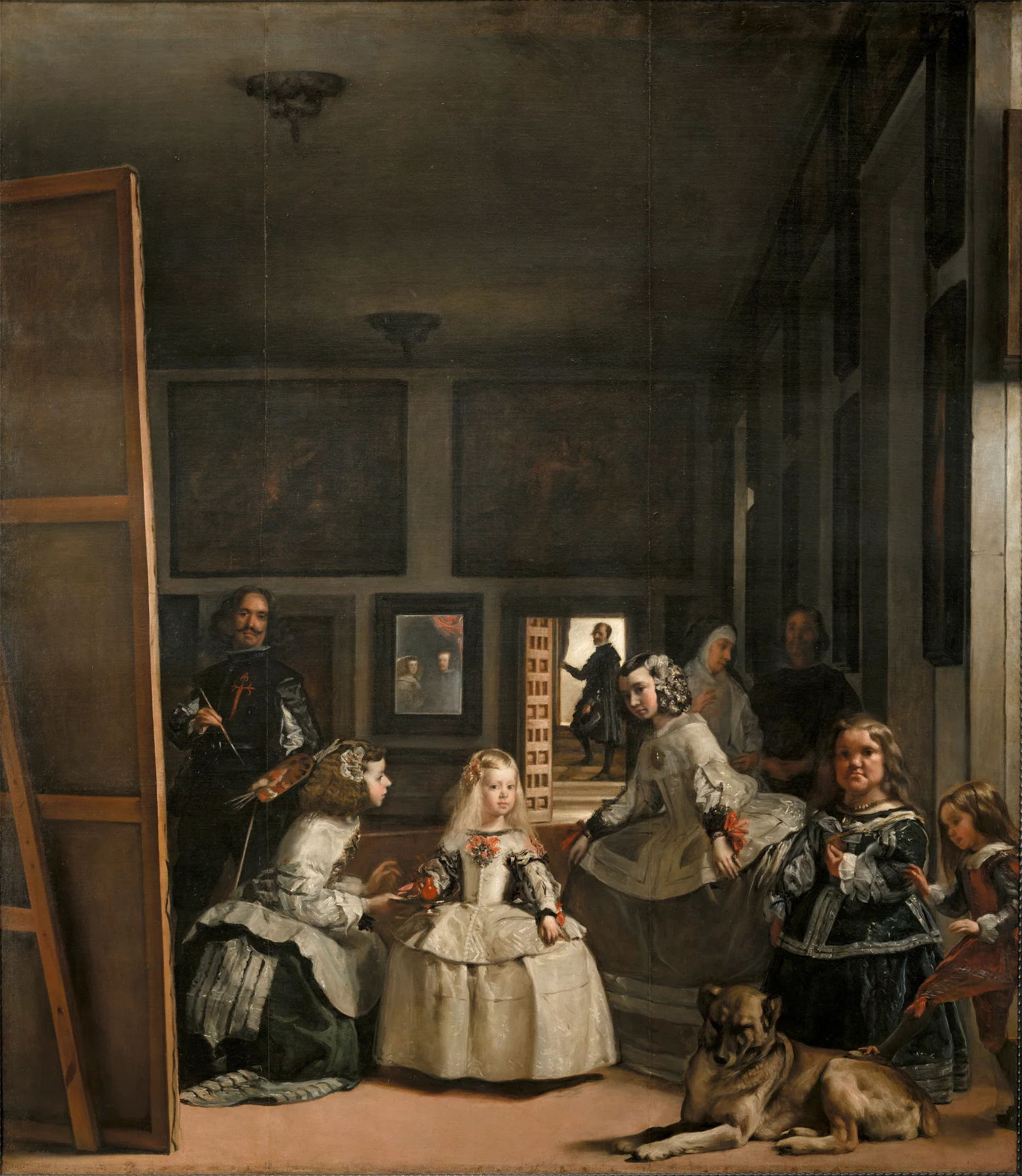 Velázquez'in Las Meninas tablosunda Infanta Margarita ile maiyeti loş saray odasında; ressam büyük tuvalin yanında, kral ile kraliçe arka duvardaki aynada görülüyor.