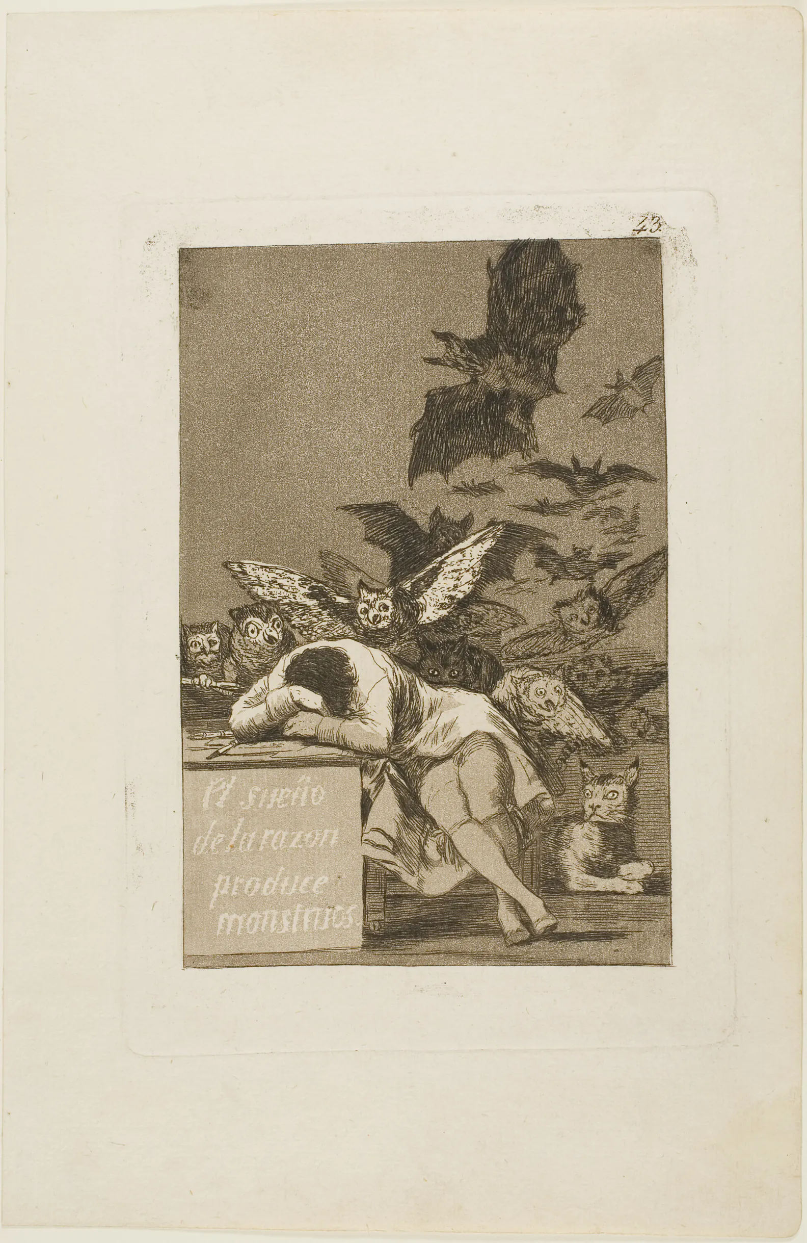 A sleeping artist at a table surrounded by owls, bats, and a lynx in Goya’s aquatint