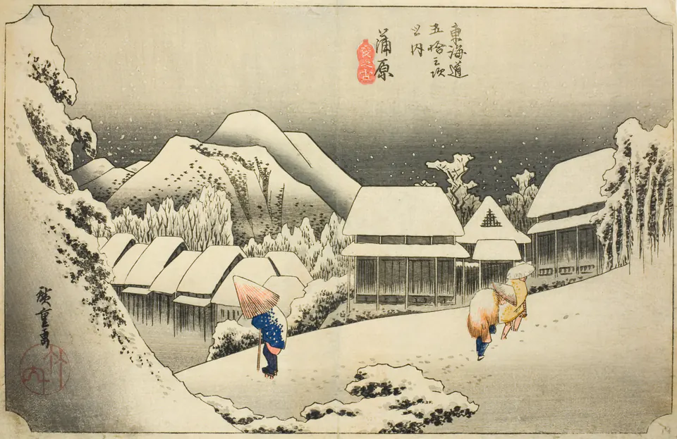 Three figures walking through deep evening snow beneath dark trees and hills at Kanbara