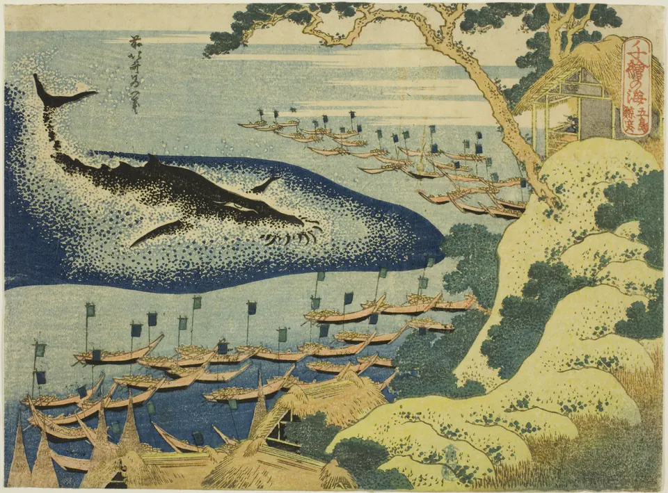 Small boats surrounding a whale beside a rocky island in a Hokusai ocean print