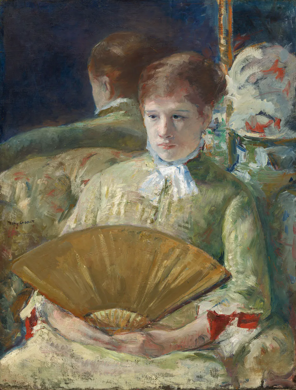 A seated woman in a pale dress holding an open fan in a portrait by Mary Cassatt