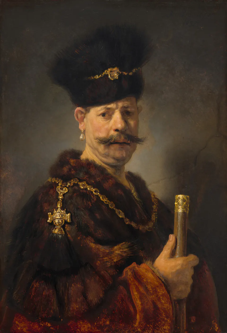 Rembrandt's Polish Nobleman, an older man in a fur hat and metal chain facing the viewer