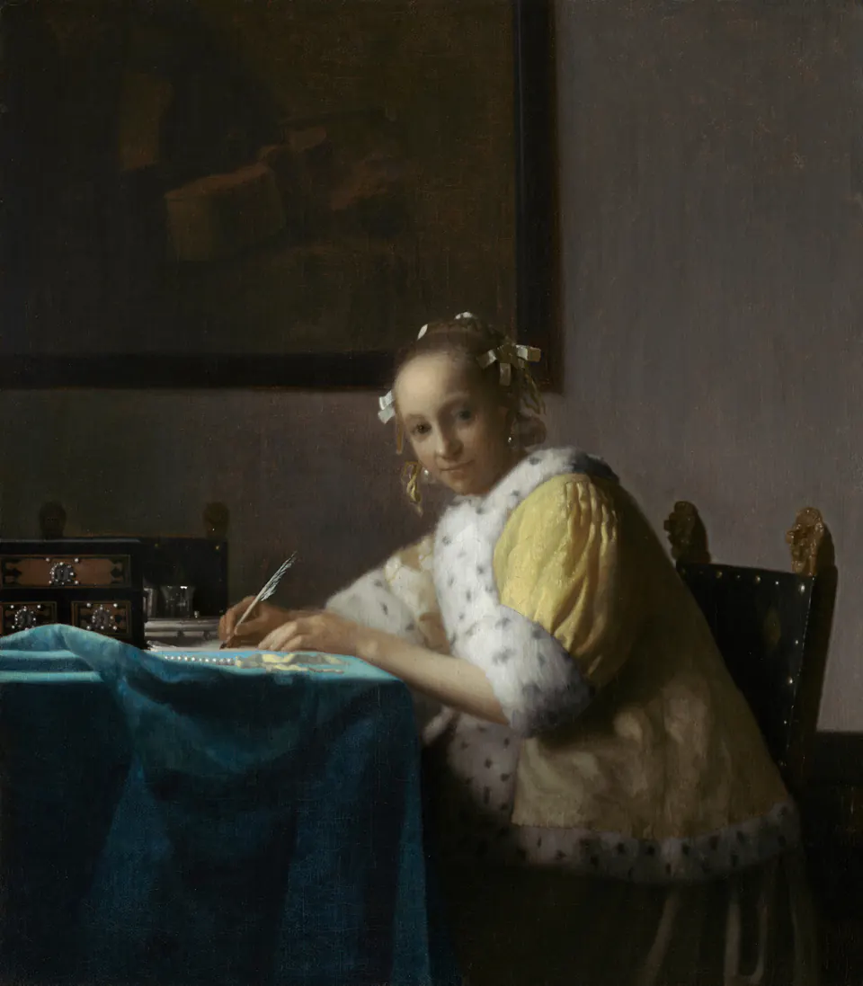 A Lady Writing by Johannes Vermeer, seated at a table and looking outward while holding a quill