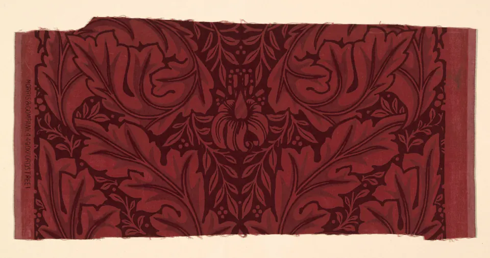 A horizontal Acanthus textile sample with dark curling leaves and small flowers