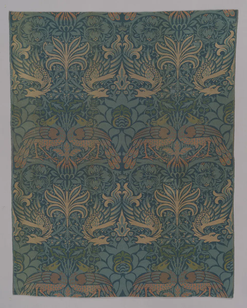 Peacocks and winged dragons alternating within a dense woven pattern designed by William Morris
