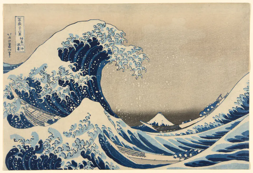 Hokusai's Great Wave, with three boats beneath a curling blue wave and Mount Fuji in the distance
