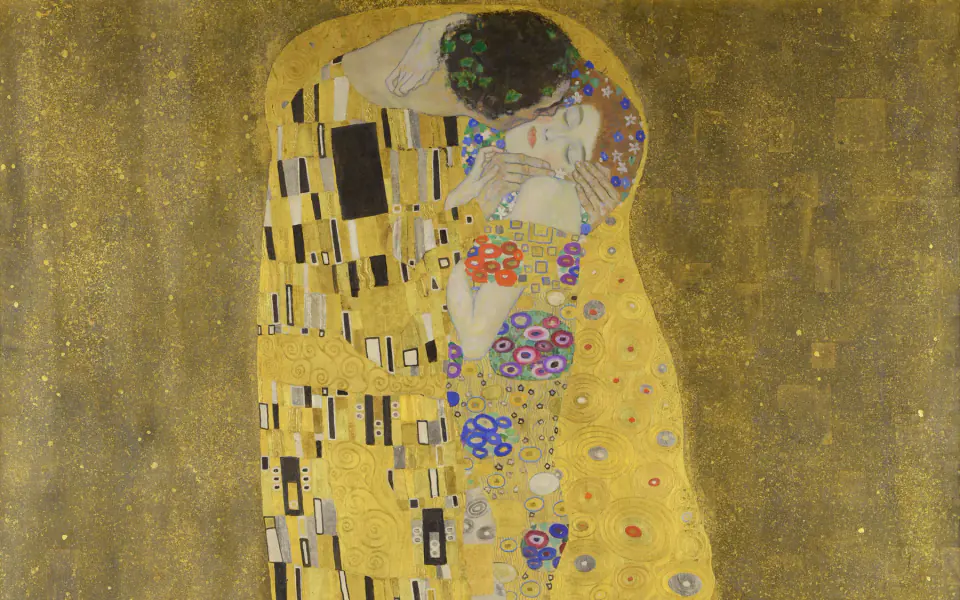Close crop of Gustav Klimt's The Kiss showing the two heads, patterned robes and gold ground
